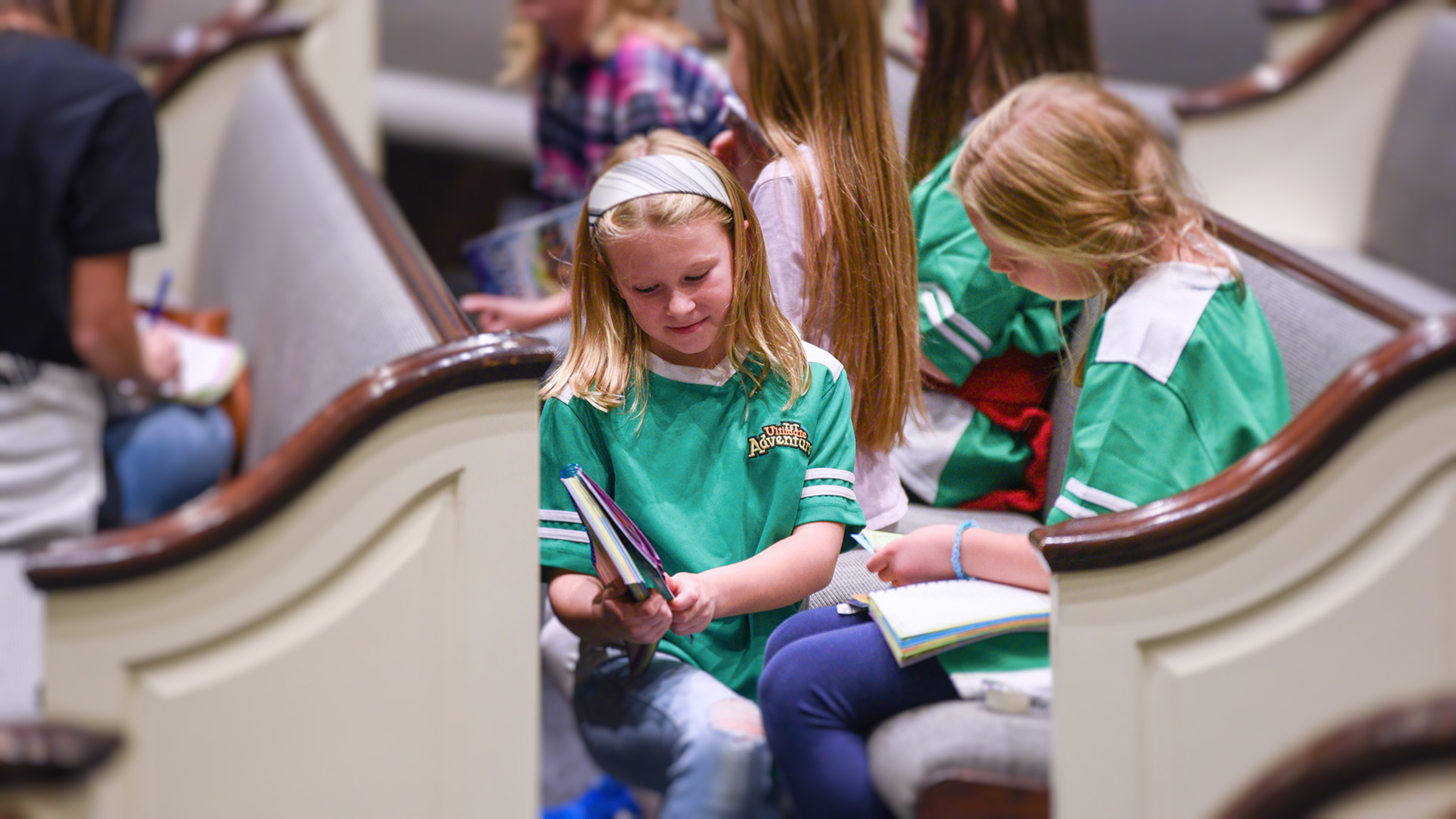 Girls working on their memory verses together at Awana.