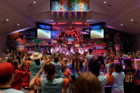 Photo of a Worship Center full of VBS kids singing songs to God