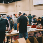 Wide view of groups packing meals.