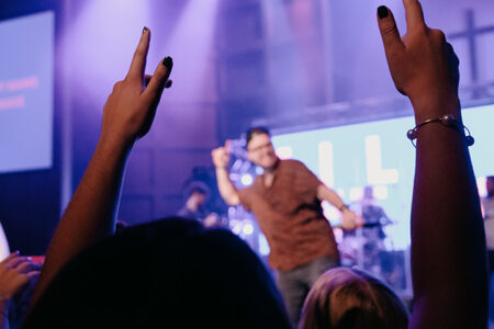 Hands up in praise during a Night of Worship